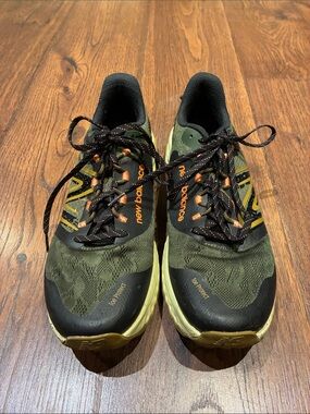 New Balance Olive Green and Black Trail Sneakers with Orange Accents